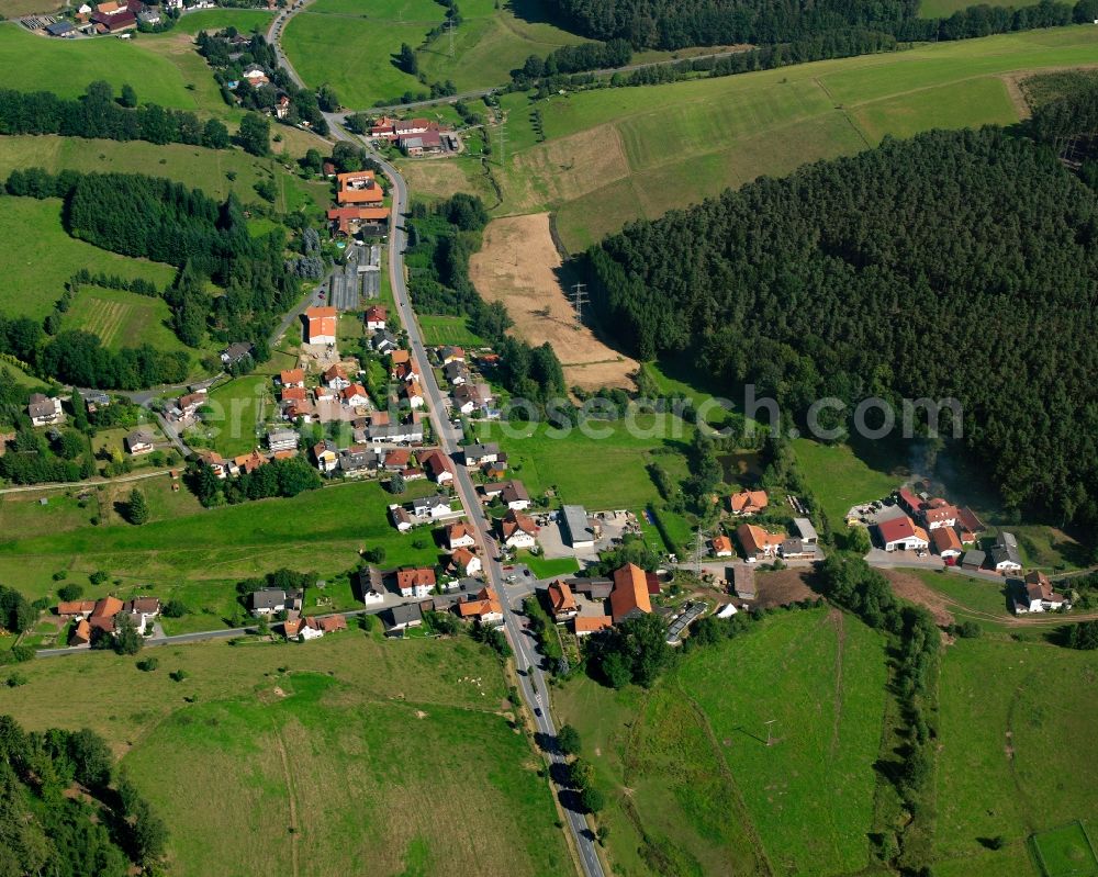 Aerial photograph Unter-Mossau - Agricultural land and field boundaries surround the settlement area of the village in Unter-Mossau in the state Hesse, Germany