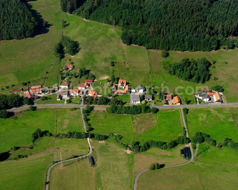 Unter-Mossau from above - Agricultural land and field boundaries surround the settlement area of the village in Unter-Mossau in the state Hesse, Germany