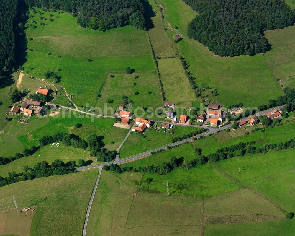 Unter-Mossau from the bird's eye view: Agricultural land and field boundaries surround the settlement area of the village in Unter-Mossau in the state Hesse, Germany