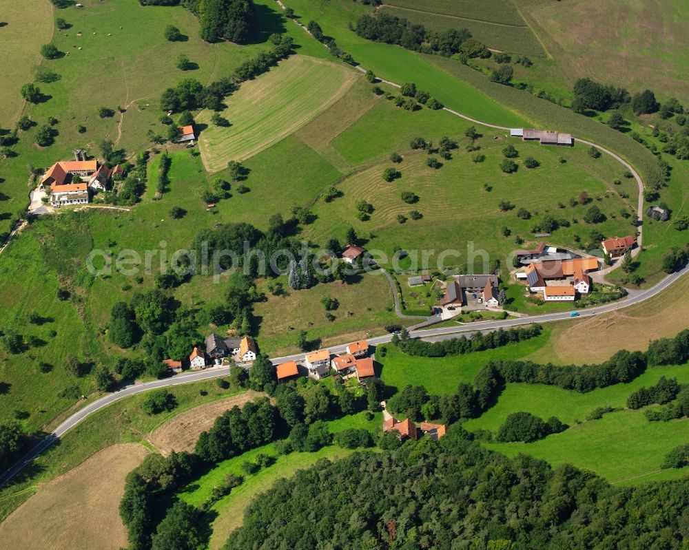 Unter-Ostern from above - Agricultural land and field boundaries surround the settlement area of the village in Unter-Ostern in the state Hesse, Germany