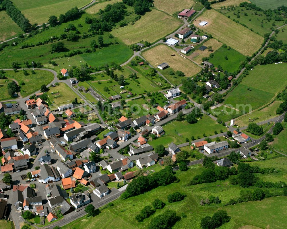 Aerial image Unter-Seibertenrod - Agricultural land and field boundaries surround the settlement area of the village in Unter-Seibertenrod in the state Hesse, Germany