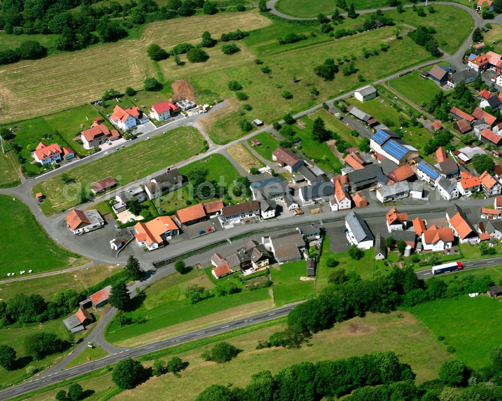 Unter-Seibertenrod from above - Agricultural land and field boundaries surround the settlement area of the village in Unter-Seibertenrod in the state Hesse, Germany