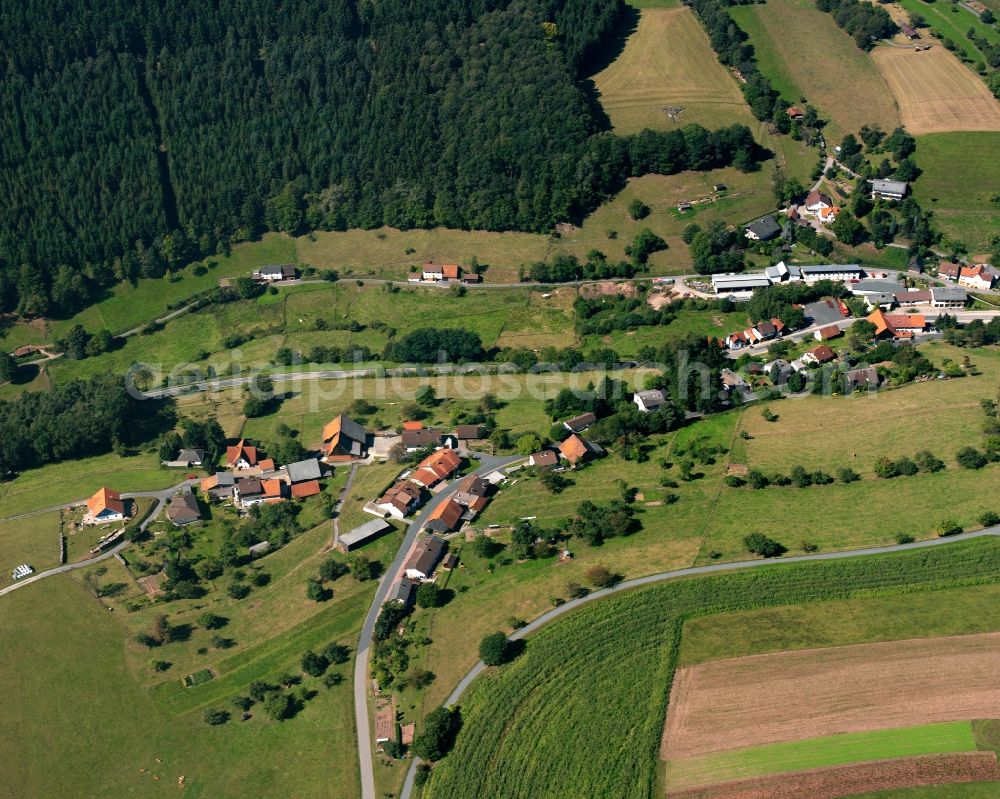 Aerial image Unter-Sensbach - Agricultural land and field boundaries surround the settlement area of the village in Unter-Sensbach in the state Hesse, Germany