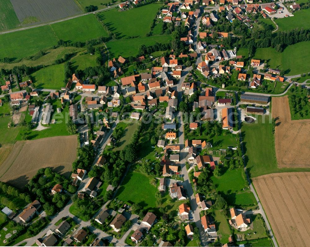 Aerial image Unterampfrach - Agricultural land and field boundaries surround the settlement area of the village in Unterampfrach in the state Bavaria, Germany