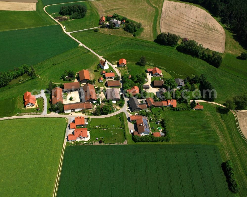 Aerial image Unterbachham - Agricultural land and field boundaries surround the settlement area of the village in Unterbachham in the state Bavaria, Germany