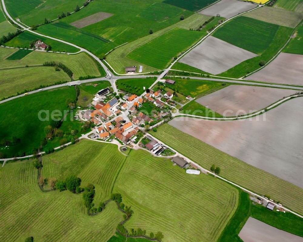 Unterfelden from above - Agricultural land and field boundaries surround the settlement area of the village in Unterfelden in the state Bavaria, Germany