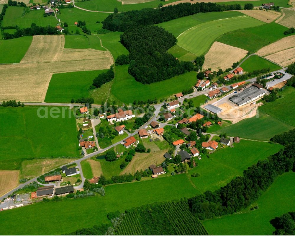 Untergschwandt from above - Agricultural land and field boundaries surround the settlement area of the village in Untergschwandt in the state Bavaria, Germany