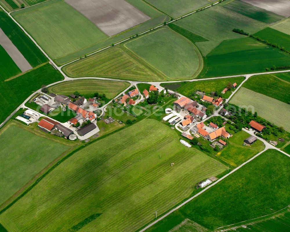 Aerial image Unterhegenau - Agricultural land and field boundaries surround the settlement area of the village in Unterhegenau in the state Bavaria, Germany