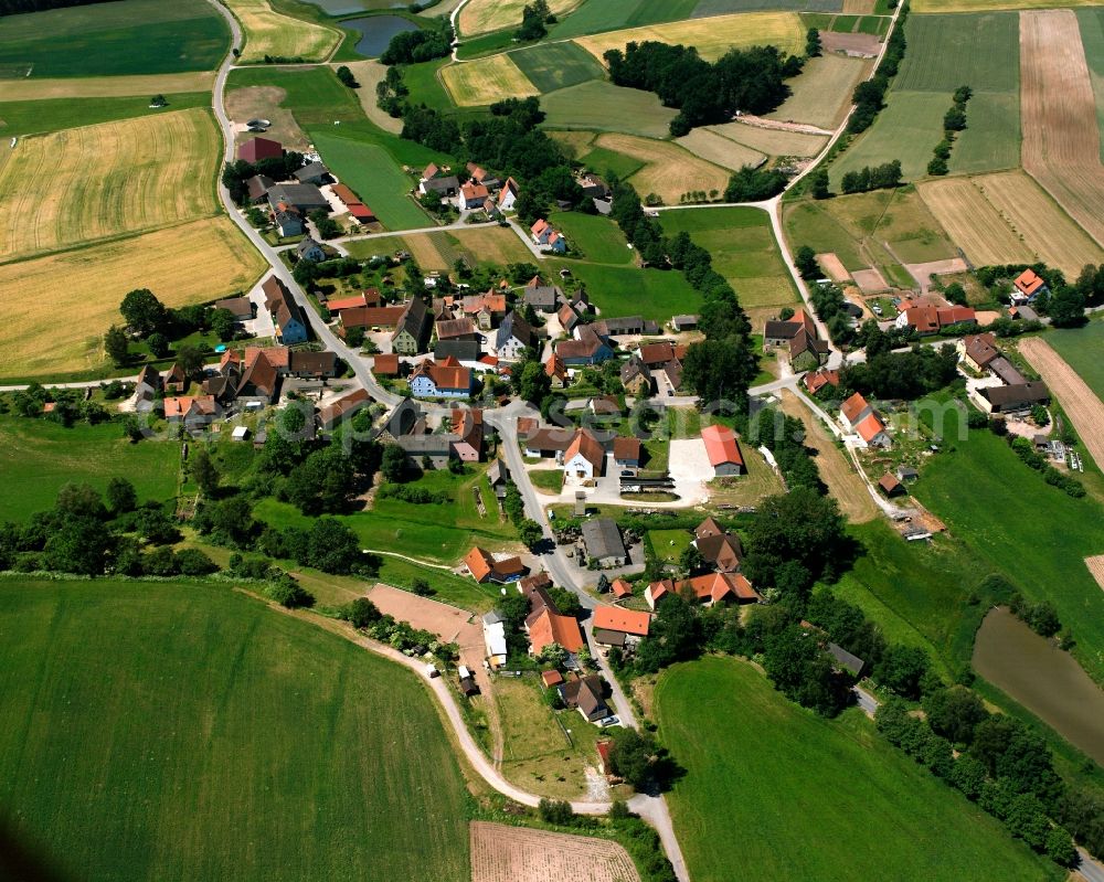 Untermosbach from the bird's eye view: Agricultural land and field boundaries surround the settlement area of the village in Untermosbach in the state Bavaria, Germany