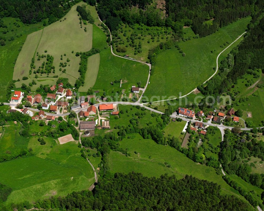 Unterneustetten from the bird's eye view: Agricultural land and field boundaries surround the settlement area of the village in Unterneustetten in the state Baden-Wuerttemberg, Germany