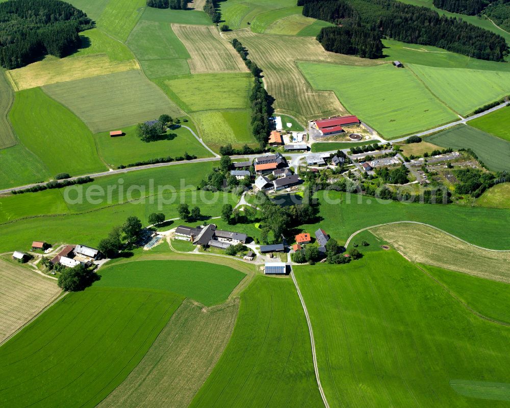 Unterpferdt from above - Agricultural land and field boundaries surround the settlement area of the village in Unterpferdt in the state Bavaria, Germany