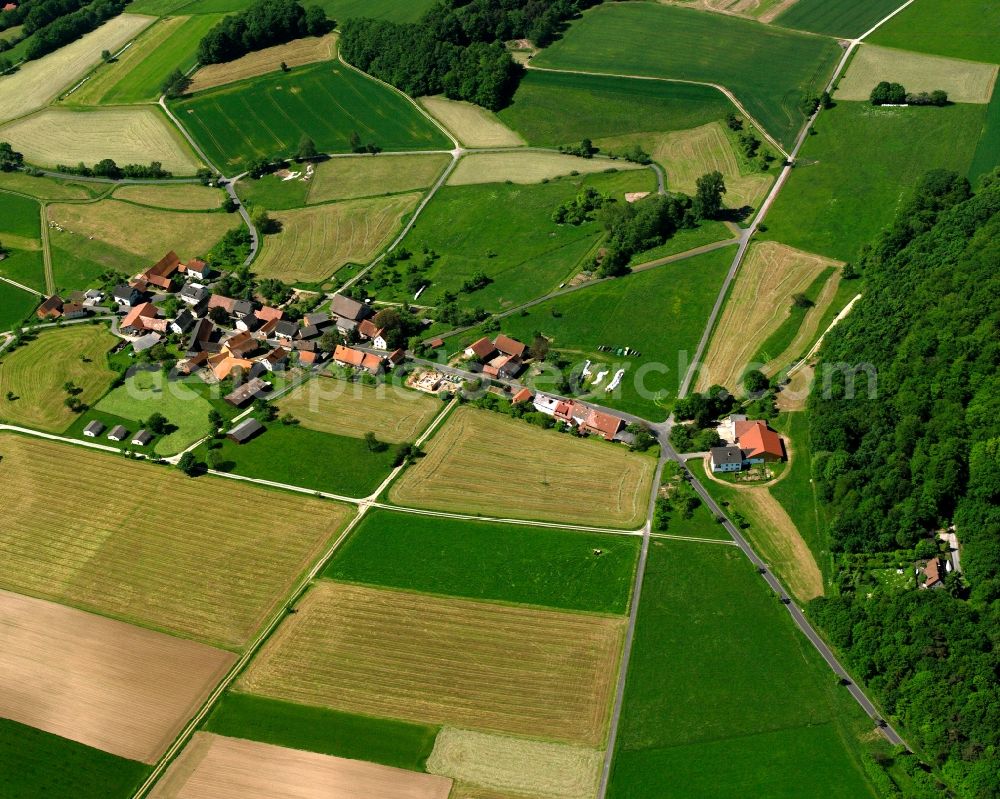 Aerial image Unterstoppel - Agricultural land and field boundaries surround the settlement area of the village in Unterstoppel in the state Hesse, Germany