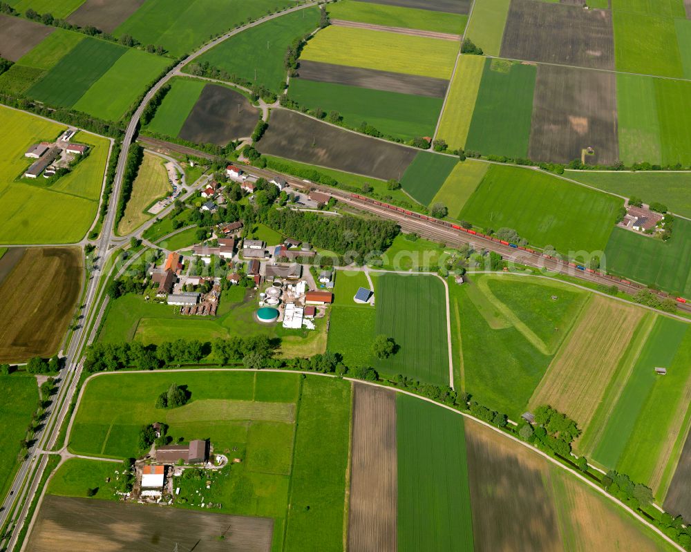 Untersulmetingen from the bird's eye view: Agricultural land and field boundaries surround the settlement area of the village in Untersulmetingen in the state Baden-Wuerttemberg, Germany