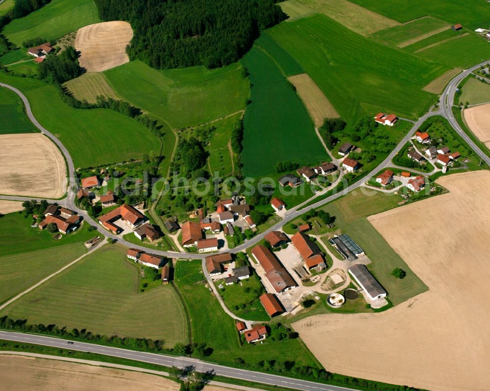 Untertattenbach from above - Agricultural land and field boundaries surround the settlement area of the village in Untertattenbach in the state Bavaria, Germany