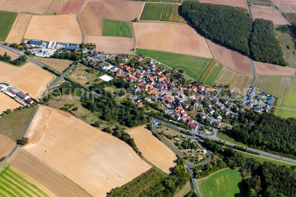 Unterwittbach from the bird's eye view: Agricultural land and field boundaries surround the settlement area of the village in Unterwittbach in the state Bavaria, Germany