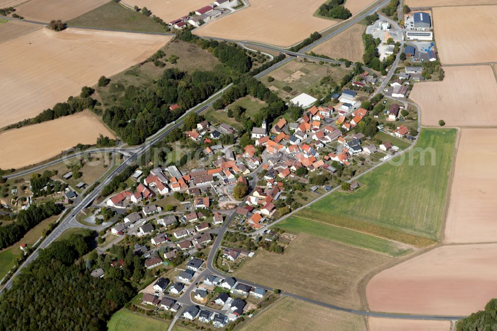 Aerial image Unterwittbach - Agricultural land and field boundaries surround the settlement area of the village in Unterwittbach in the state Bavaria, Germany