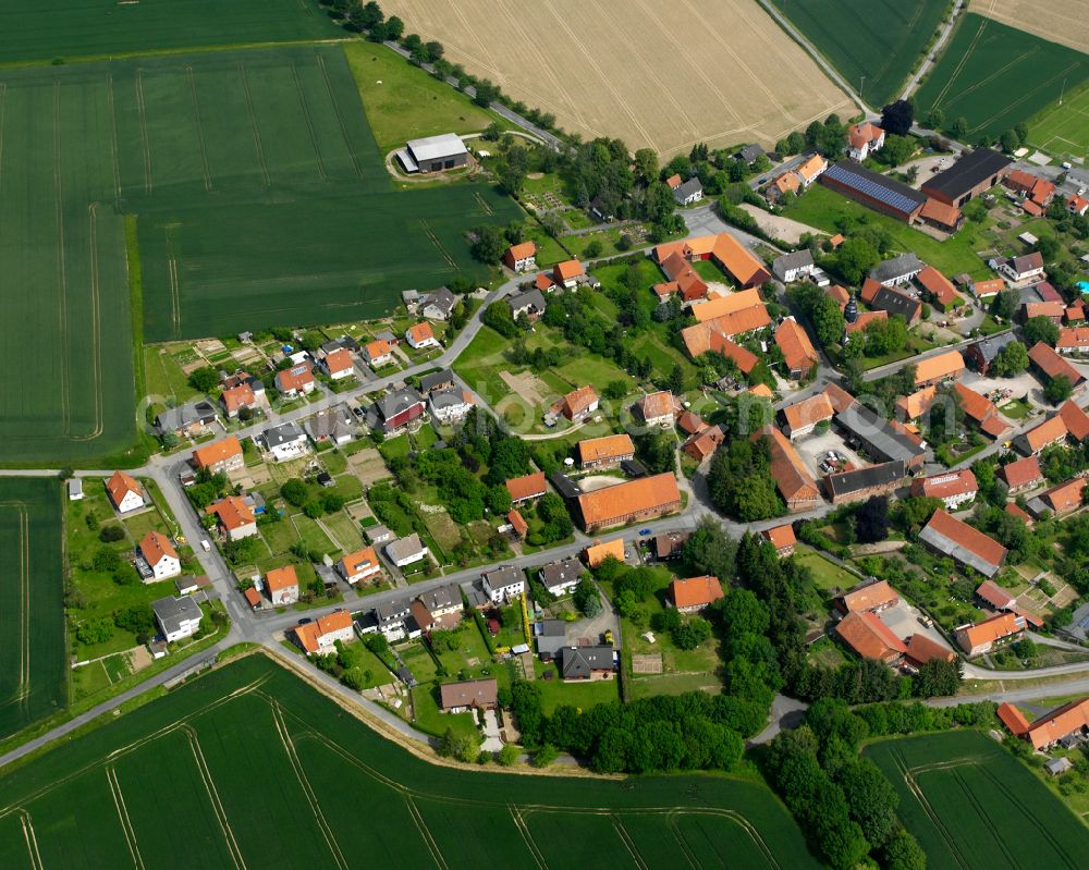 Upen from above - Agricultural land and field boundaries surround the settlement area of the village in Upen in the state Lower Saxony, Germany