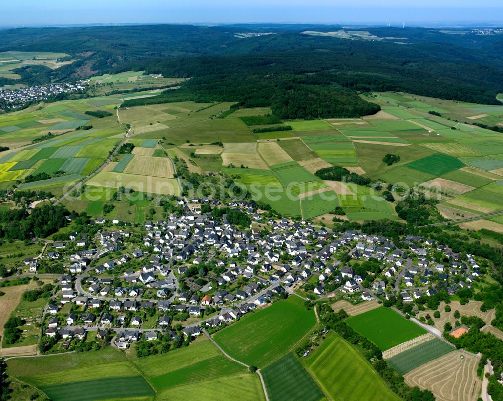 Urbar from above - Agricultural land and field boundaries surround the settlement area of the village in Urbar in the state Rhineland-Palatinate, Germany