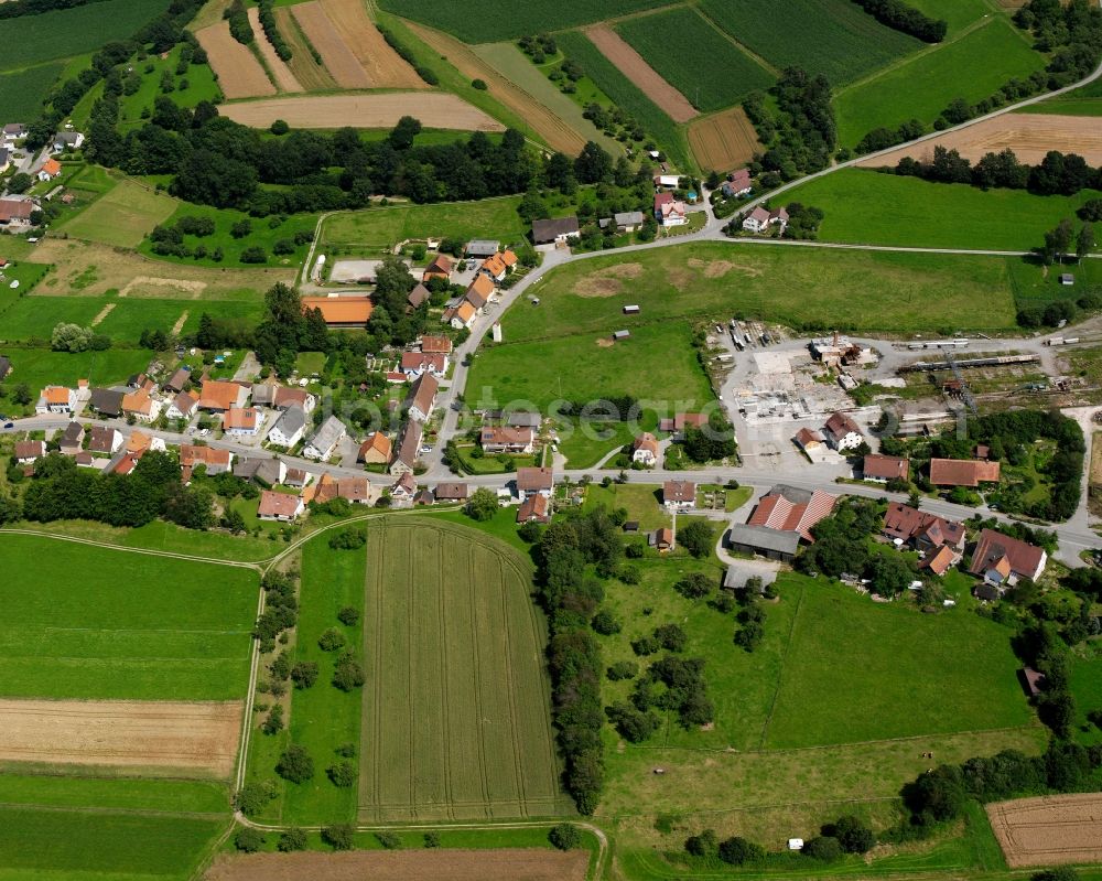 Ursendorf from above - Agricultural land and field boundaries surround the settlement area of the village in Ursendorf in the state Baden-Wuerttemberg, Germany