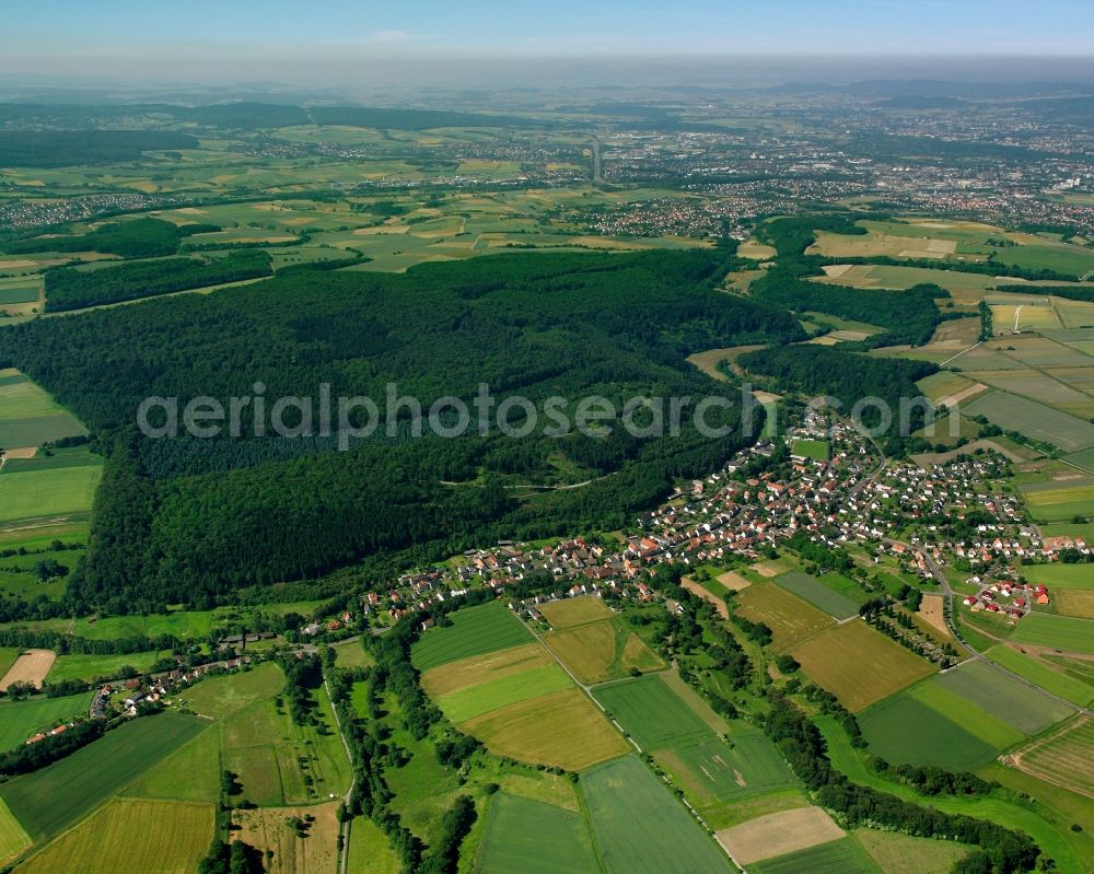 Uschlag from above - Agricultural land and field boundaries surround the settlement area of the village in Uschlag in the state Lower Saxony, Germany