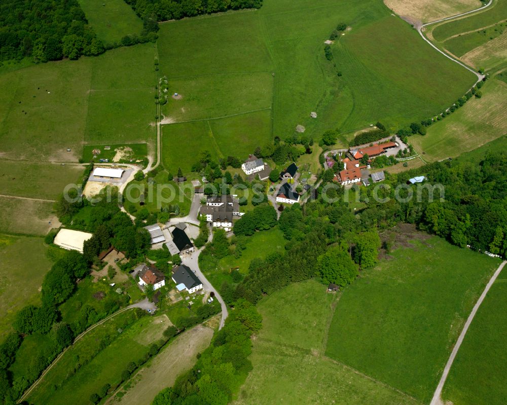 Aerial photograph Valbert - Agricultural land and field boundaries surround the settlement area of the village in Valbert in the state North Rhine-Westphalia, Germany