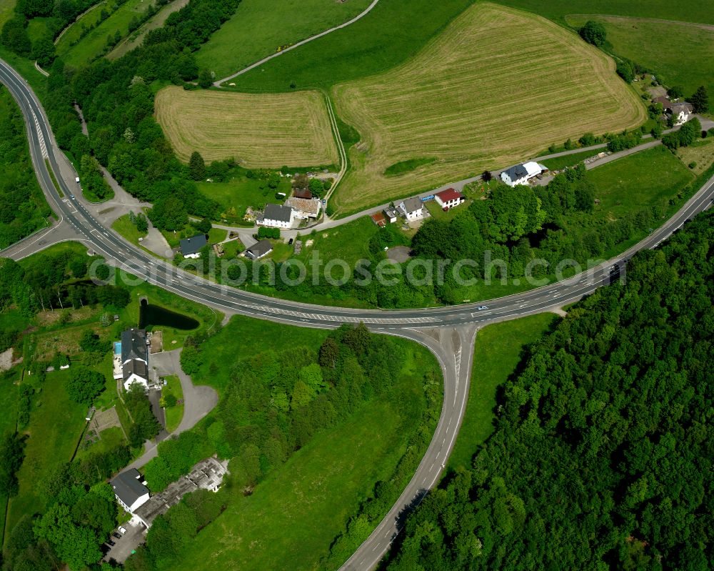 Valbert from above - Agricultural land and field boundaries surround the settlement area of the village in Valbert in the state North Rhine-Westphalia, Germany