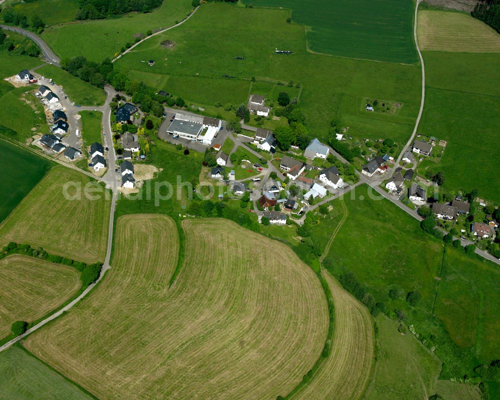 Aerial photograph Valbert - Agricultural land and field boundaries surround the settlement area of the village in Valbert in the state North Rhine-Westphalia, Germany