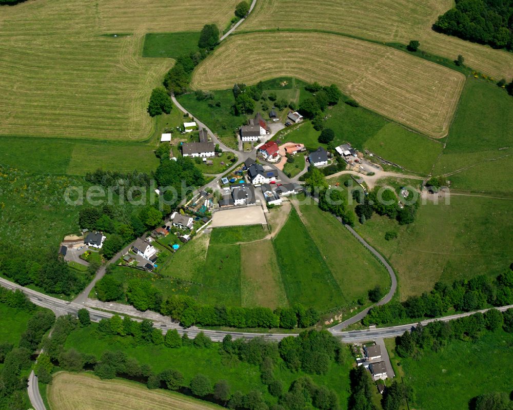 Aerial image Valbert - Agricultural land and field boundaries surround the settlement area of the village in Valbert in the state North Rhine-Westphalia, Germany