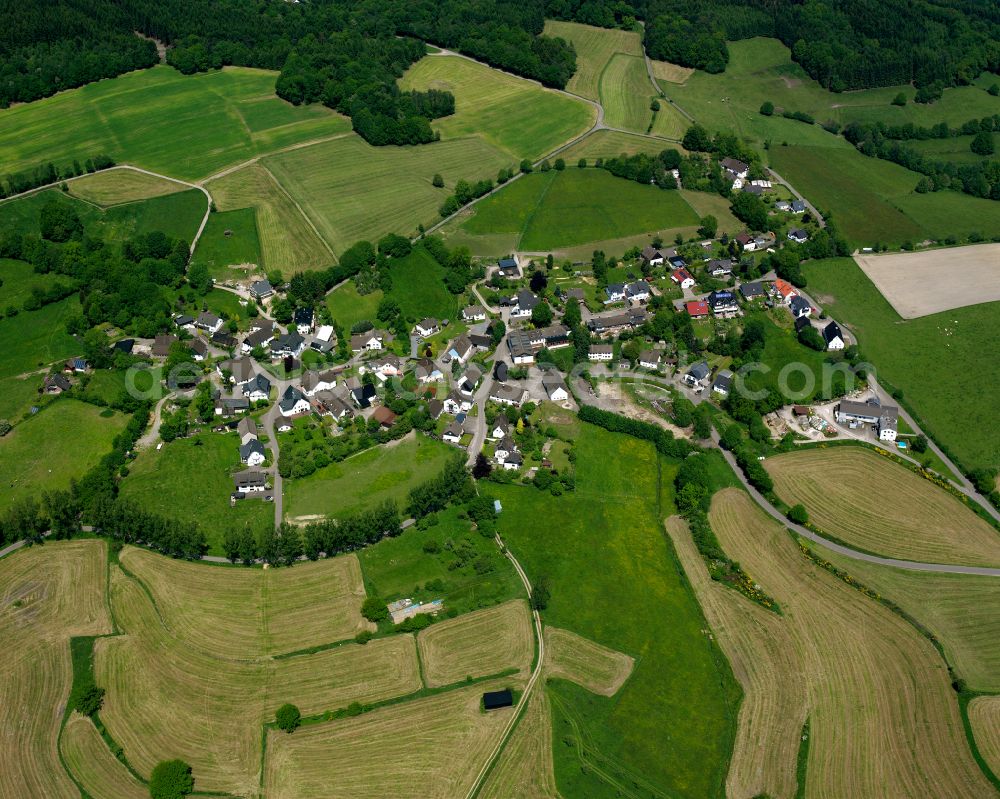 Aerial photograph Valbert - Agricultural land and field boundaries surround the settlement area of the village in Valbert in the state North Rhine-Westphalia, Germany