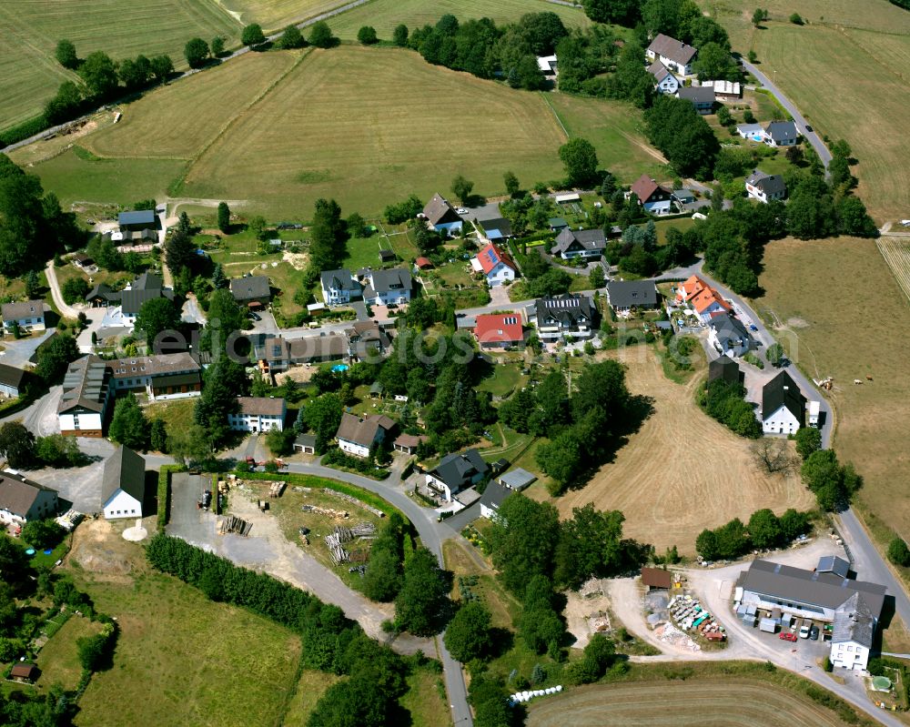 Aerial image Valbert - Agricultural land and field boundaries surround the settlement area of the village in Valbert in the state North Rhine-Westphalia, Germany