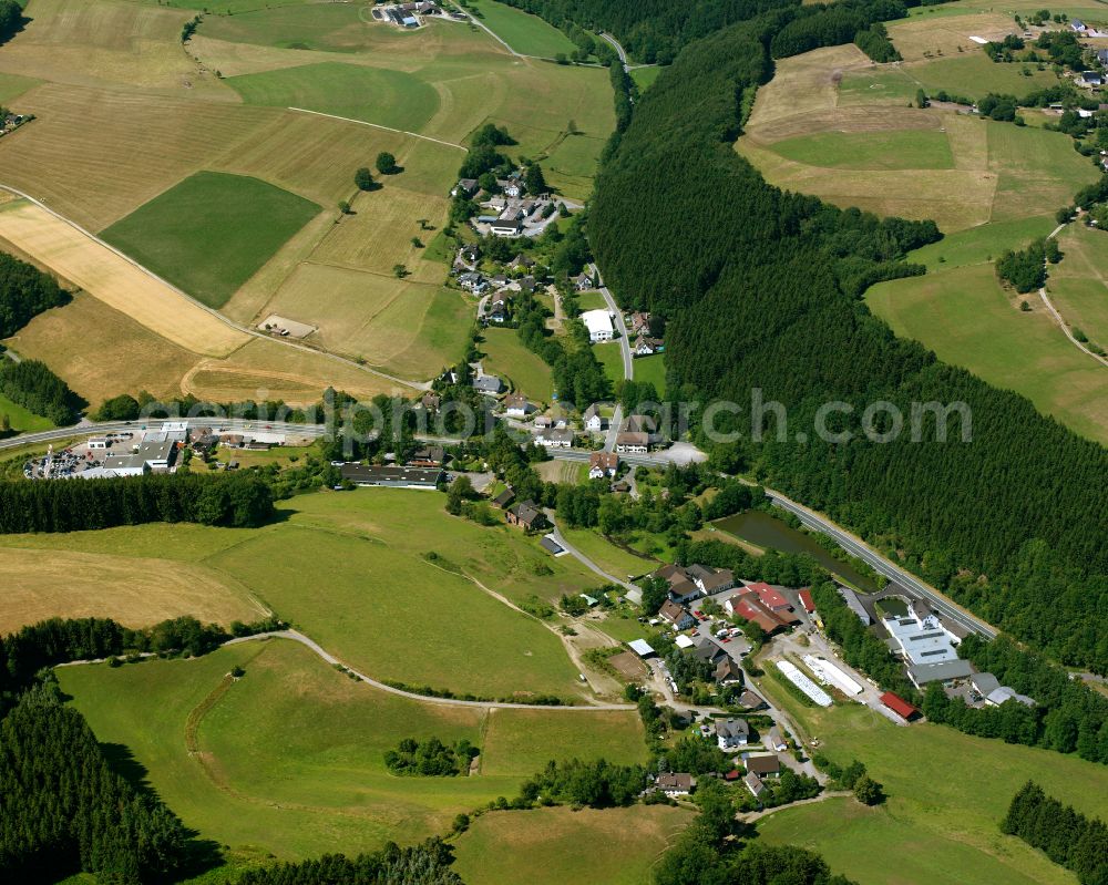 Aerial image Valbert - Agricultural land and field boundaries surround the settlement area of the village in Valbert in the state North Rhine-Westphalia, Germany