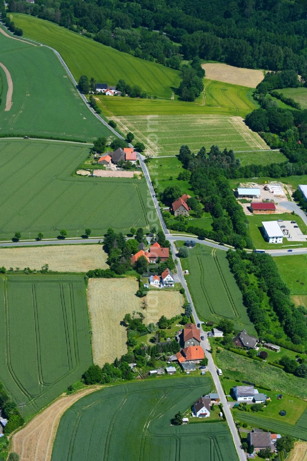 Aerial image Valdorf - Agricultural land and field boundaries surround the settlement area of the village in Valdorf in the state North Rhine-Westphalia, Germany