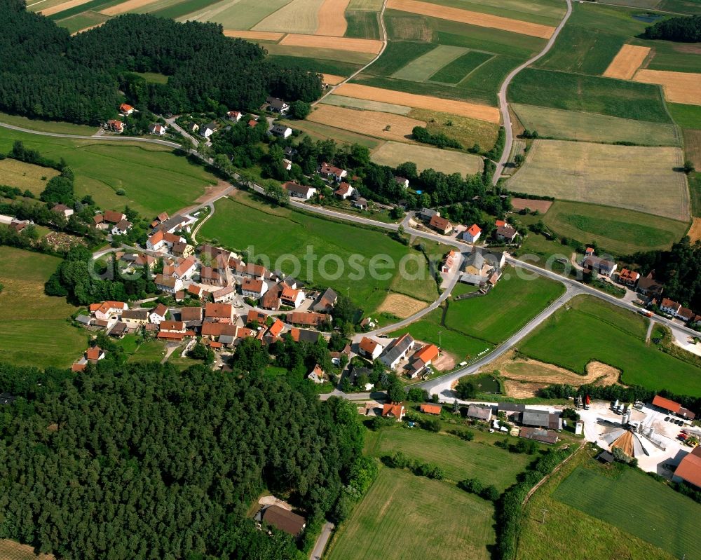 Veitsaurach from above - Agricultural land and field boundaries surround the settlement area of the village in Veitsaurach in the state Bavaria, Germany