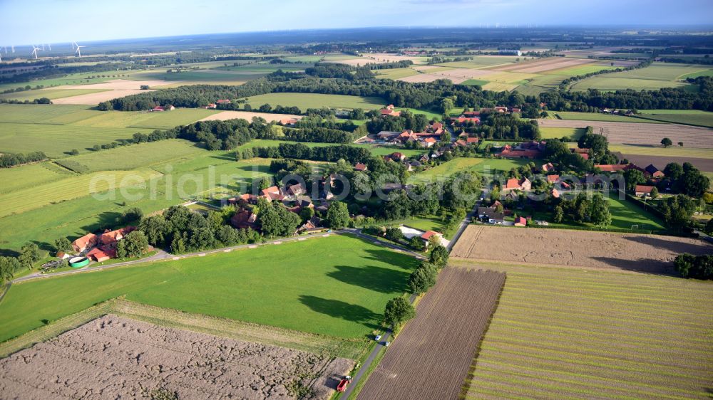 Vethem from the bird's eye view: Agricultural land and field boundaries surround the settlement area of the village in Vethem in the state Lower Saxony, Germany