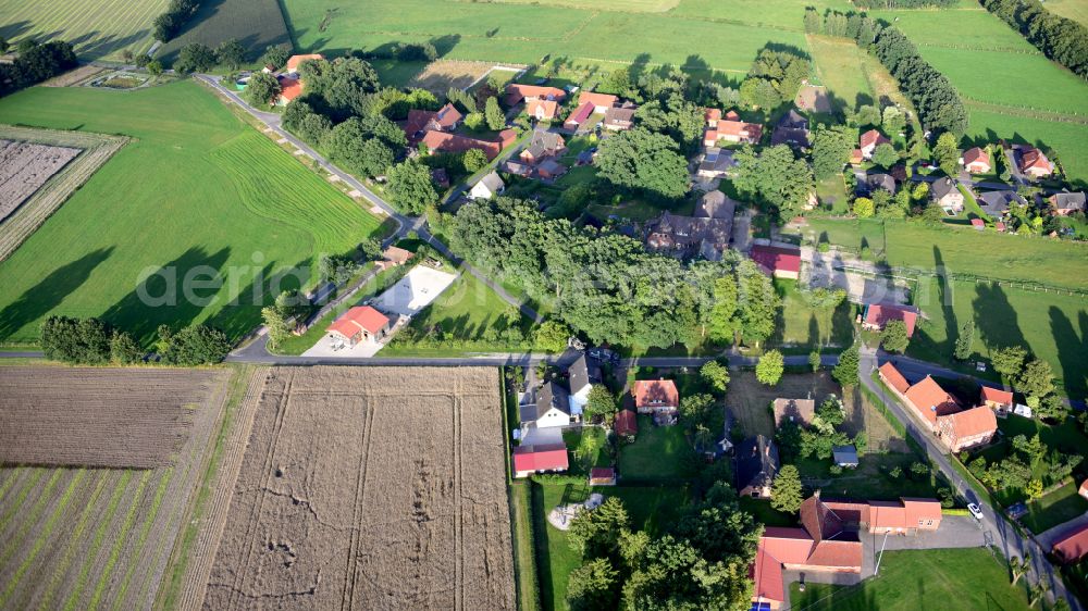 Vethem from above - Agricultural land and field boundaries surround the settlement area of the village in Vethem in the state Lower Saxony, Germany