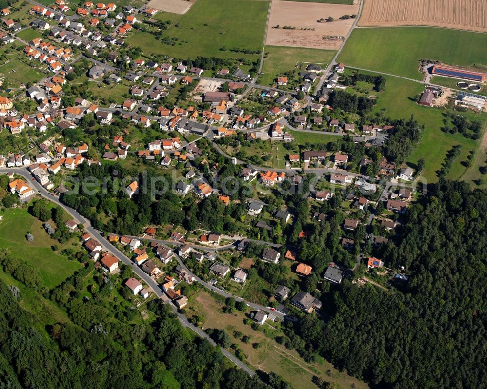 Aerial photograph Vielbrunn - Agricultural land and field boundaries surround the settlement area of the village in Vielbrunn in the state Hesse, Germany