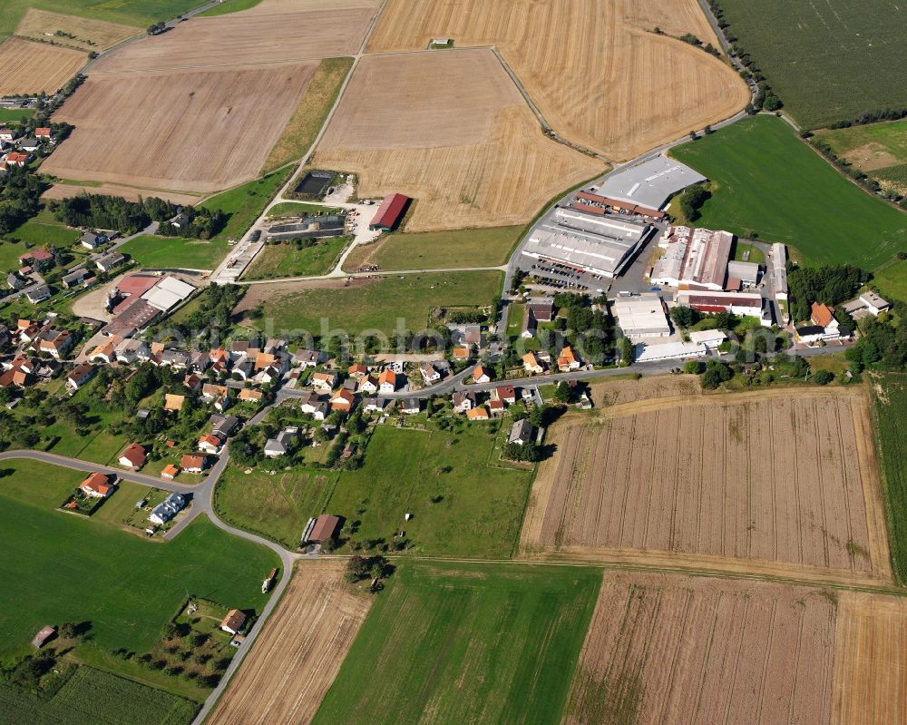 Vielbrunn from the bird's eye view: Agricultural land and field boundaries surround the settlement area of the village in Vielbrunn in the state Hesse, Germany