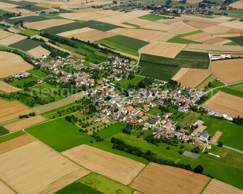 Völlkofen from above - Agricultural land and field boundaries surround the settlement area of the village in Völlkofen in the state Baden-Wuerttemberg, Germany