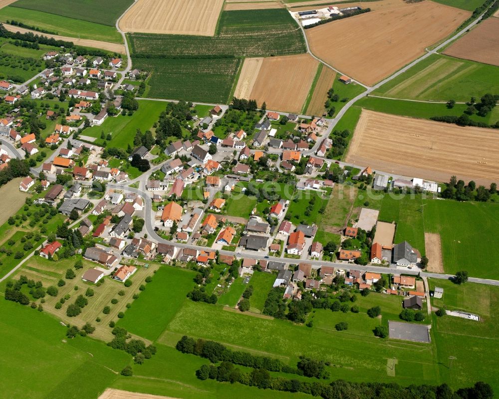 Völlkofen from the bird's eye view: Agricultural land and field boundaries surround the settlement area of the village in Völlkofen in the state Baden-Wuerttemberg, Germany