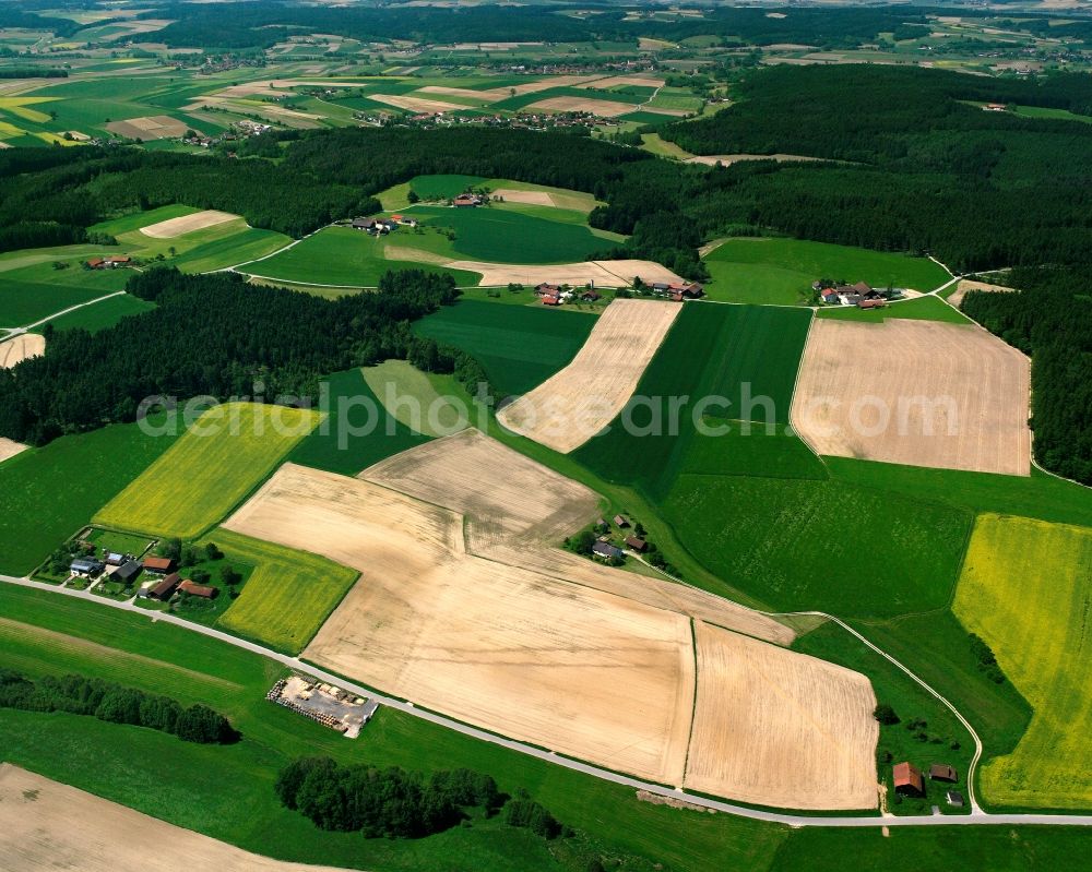 Vogelbichl from the bird's eye view: Agricultural land and field boundaries surround the settlement area of the village in Vogelbichl in the state Bavaria, Germany