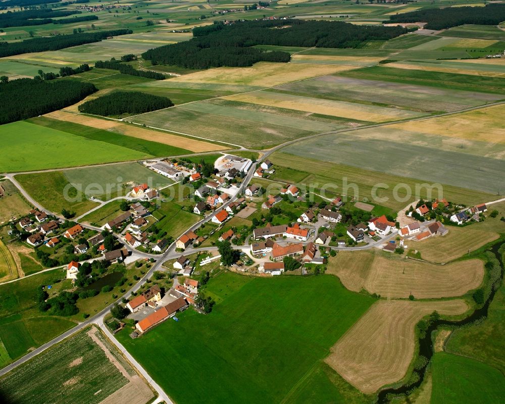 Aerial photograph Voggendorf - Agricultural land and field boundaries surround the settlement area of the village in Voggendorf in the state Bavaria, Germany