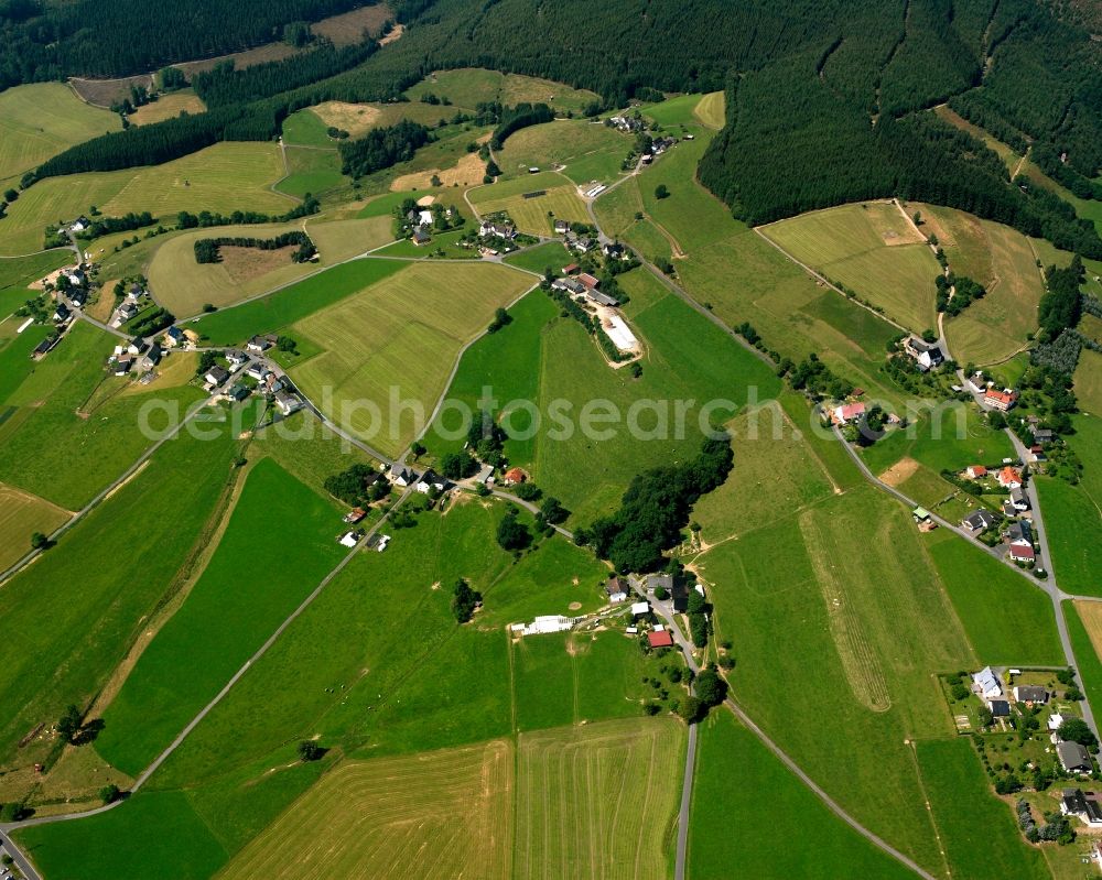 Aerial photograph Volkholz - Agricultural land and field boundaries surround the settlement area of the village in Volkholz in the state North Rhine-Westphalia, Germany