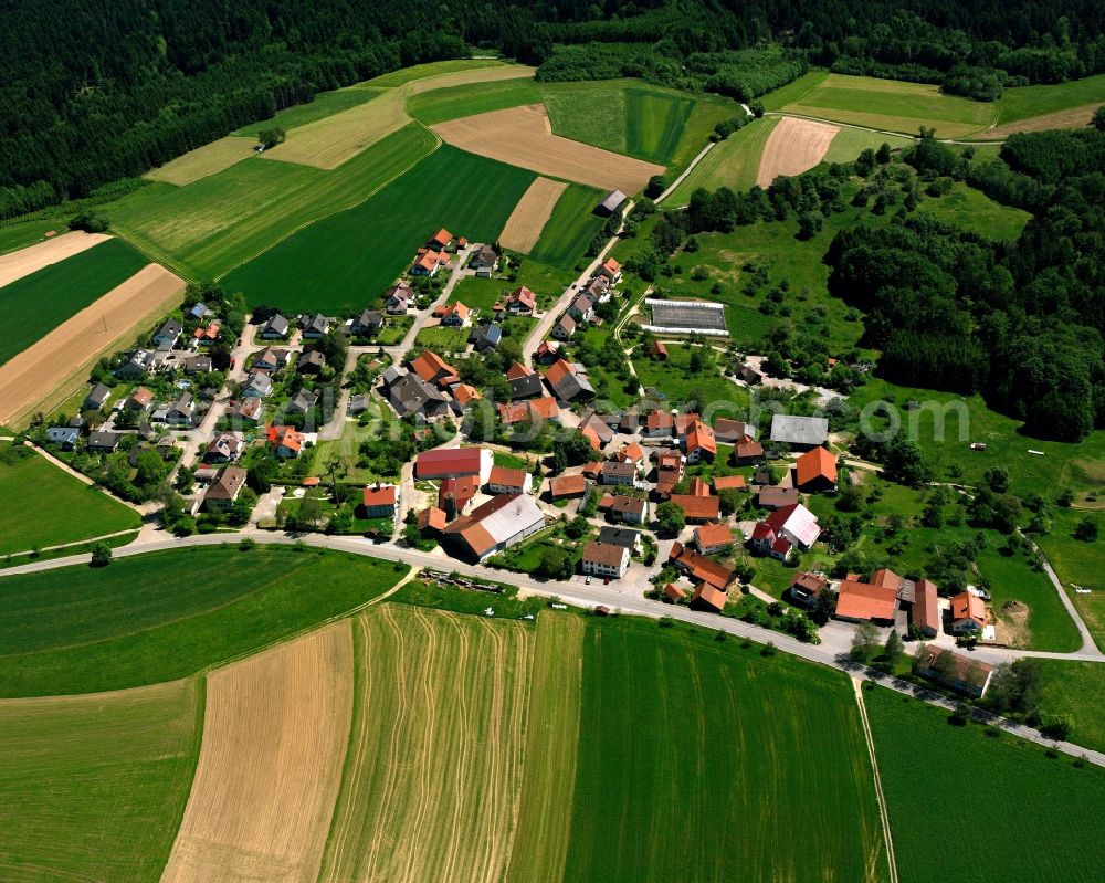 Vordersteinenberg from above - Agricultural land and field boundaries surround the settlement area of the village in Vordersteinenberg in the state Baden-Wuerttemberg, Germany