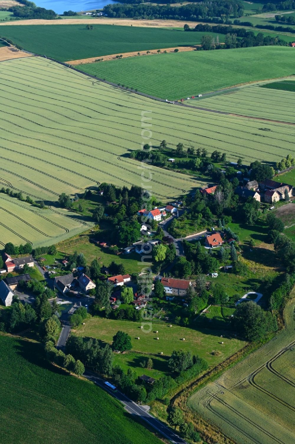 Wadewitz from above - Agricultural land and field boundaries surround the settlement area of the village in Wadewitz in the state Saxony, Germany