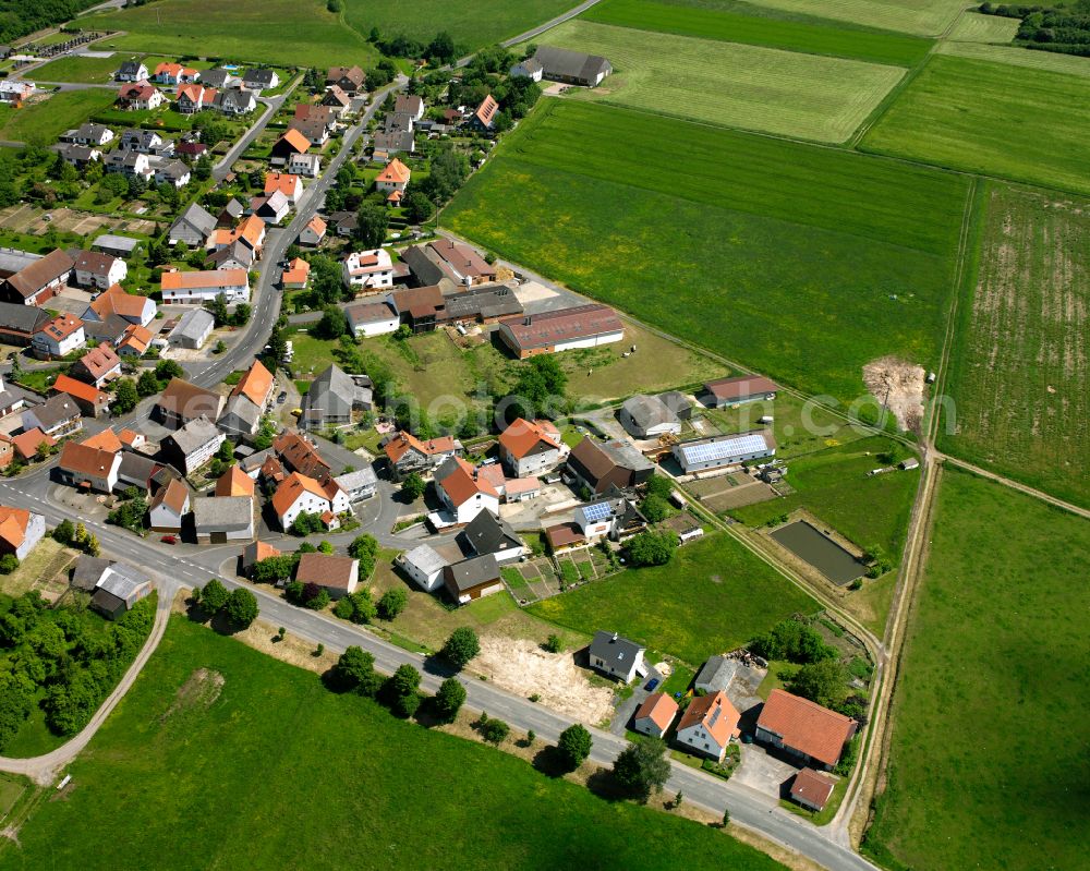 Aerial image Wahlen - Agricultural land and field boundaries surround the settlement area of the village in Wahlen in the state Hesse, Germany