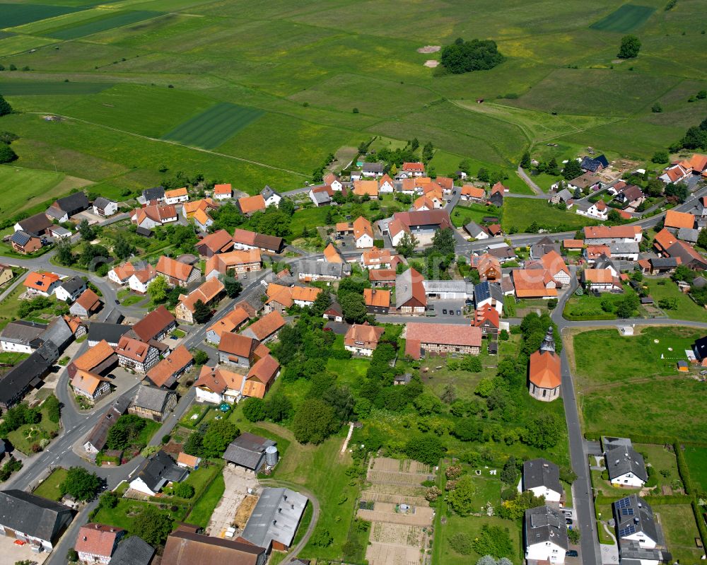 Wahlen from above - Agricultural land and field boundaries surround the settlement area of the village in Wahlen in the state Hesse, Germany