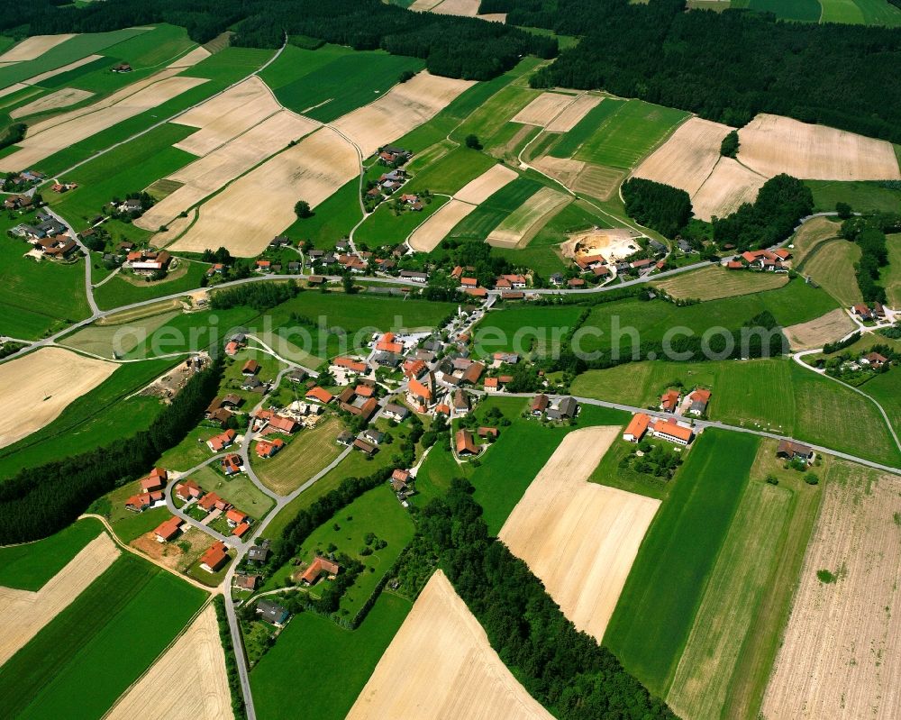 Walburgskirchen from the bird's eye view: Agricultural land and field boundaries surround the settlement area of the village in Walburgskirchen in the state Bavaria, Germany