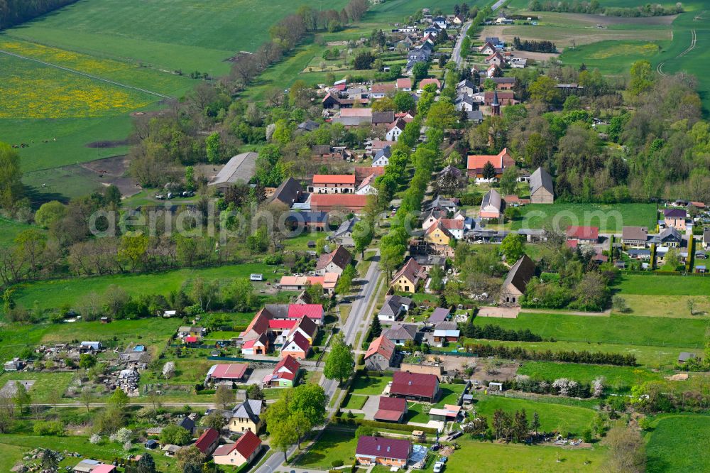 Aerial photograph Walchow - Agricultural land and field boundaries surround the settlement area of the village in Walchow in the state Brandenburg, Germany