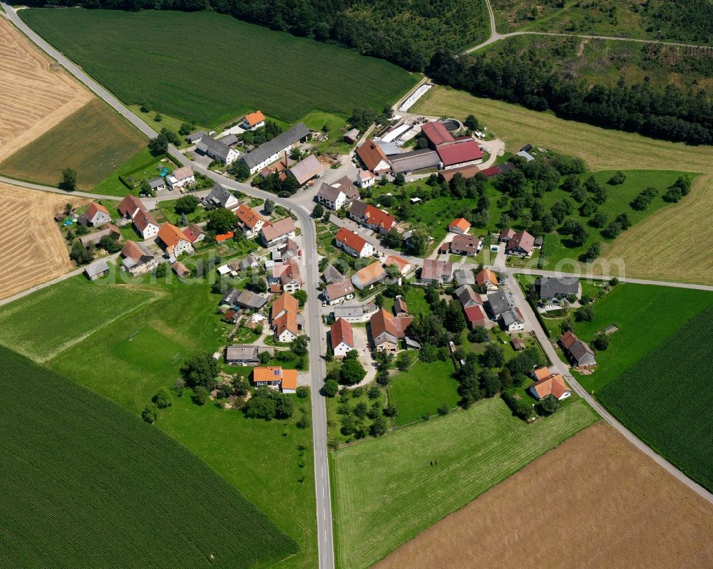 Wald from above - Agricultural land and field boundaries surround the settlement area of the village in Wald in the state Baden-Wuerttemberg, Germany