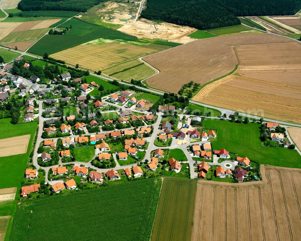 Wald from above - Agricultural land and field boundaries surround the settlement area of the village in Wald in the state Baden-Wuerttemberg, Germany